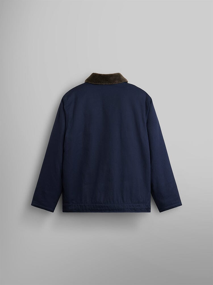 The 1940s N-1 Deck Jacket by Alpha Industries is styled after a classic US Navy design and showcases a brown collar. The jacket's dark blue hue is displayed from the back.