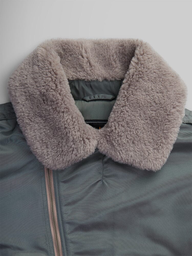 Close-up of the 1960s RCAF Canadian Airforce Type III Jacket in field gray by Alpha Industries, showcasing its large, fluffy beige collar.