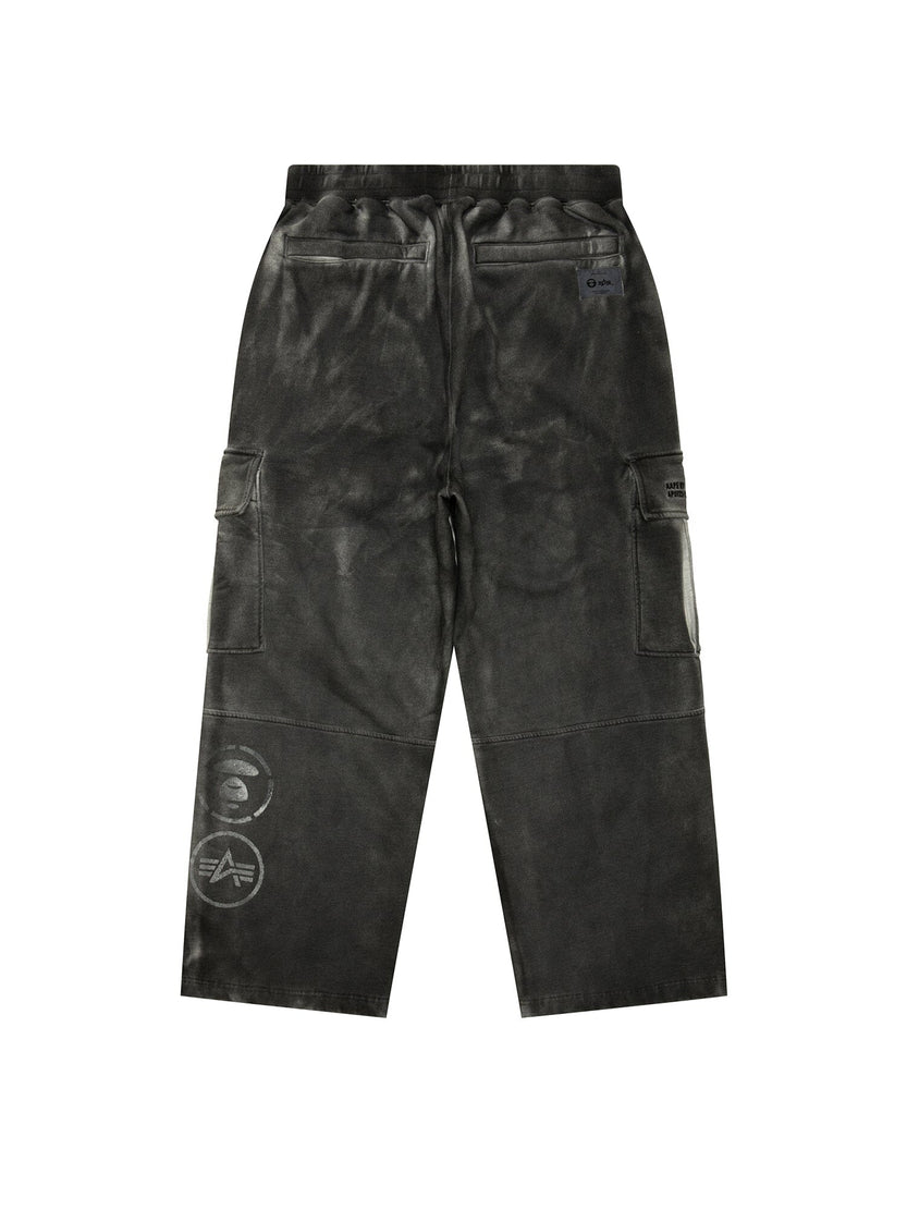 Aape X Alpha Army Sweatpant by Alpha Industries, dark green, military elements, back and side pockets, visible seam details, graphic logos on left leg.