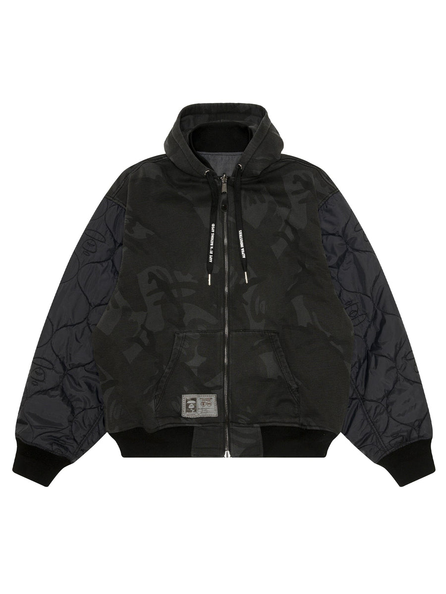 Aape X Alpha Reversible Padded MA-1 Quilted Jacket by Alpha Industries, black hood, quilted sleeves, camo body, front pockets, patch near hem.