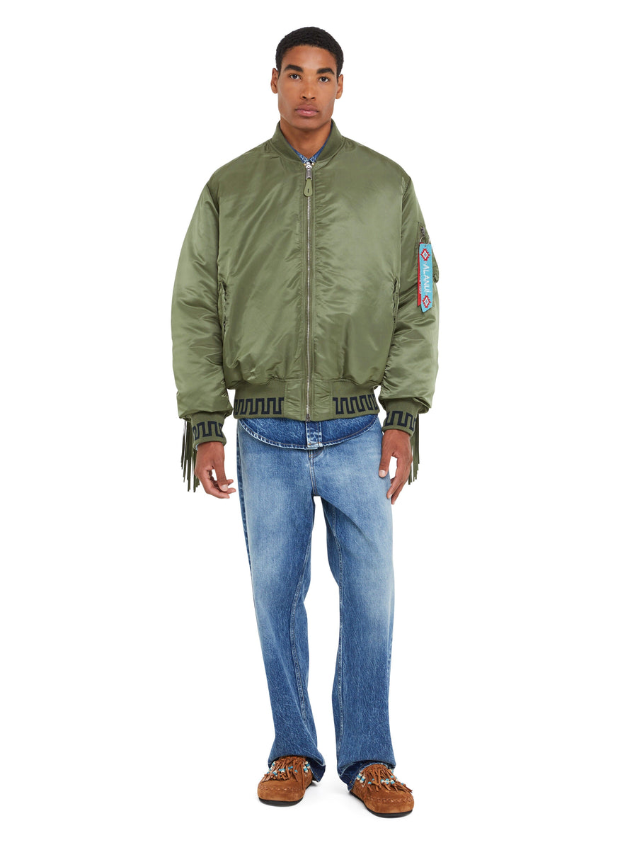 MA-1 Jacket by Alpha Industries in green with ribbed cuffs, front zipper closure, and utility sleeve pocket.