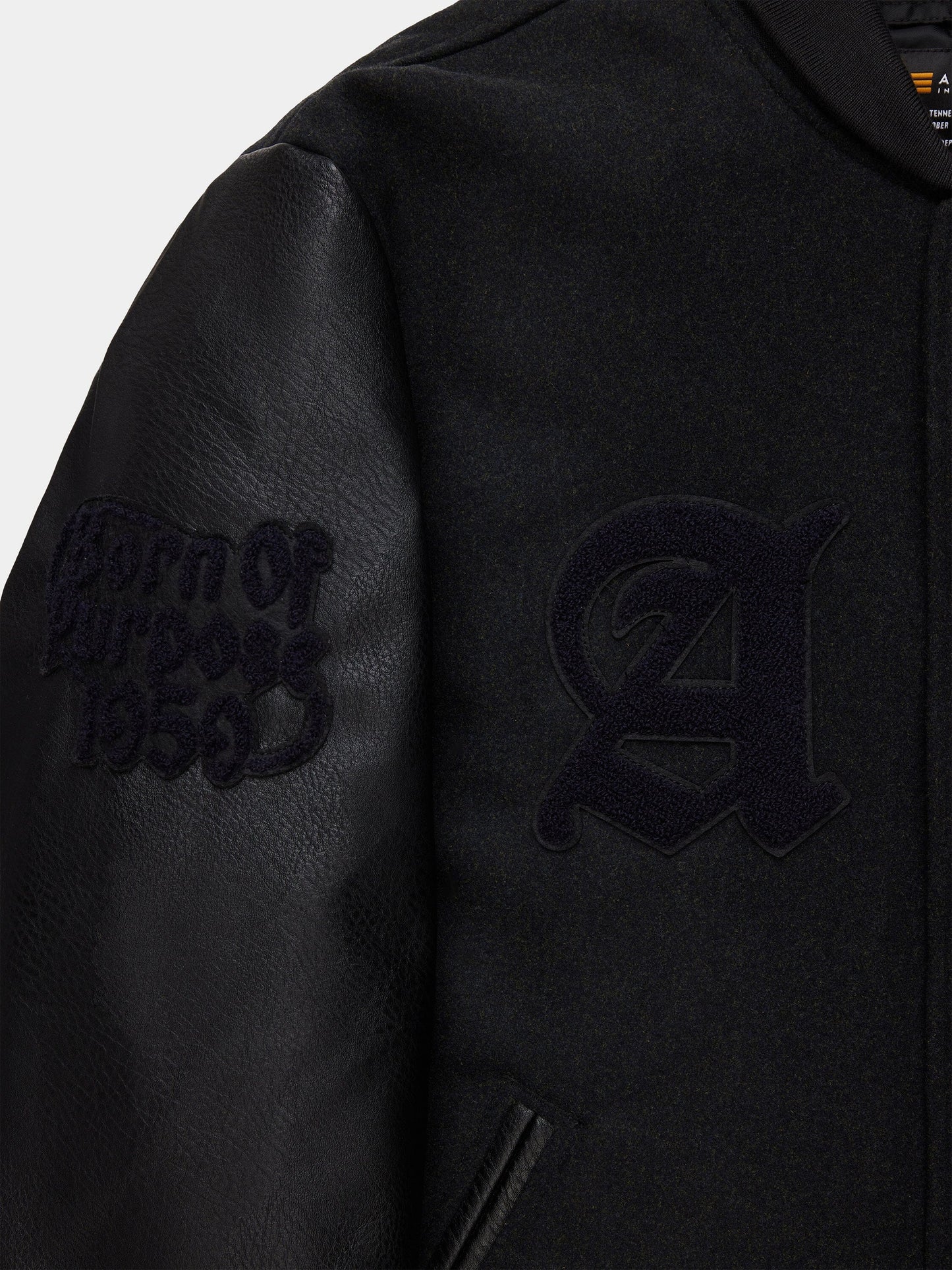 Alpha Industries Alpha Letterman Jacket, large A patch on chest, "Born of Purpose 1958" on faux leather sleeve, wool blend.