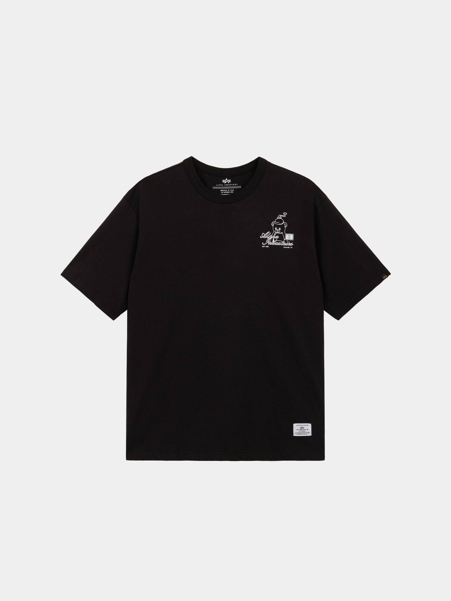 Alpha Toy Bear Tee by Alpha Industries, black 100% cotton short-sleeve with small white graphic and text on left chest, white hem label.