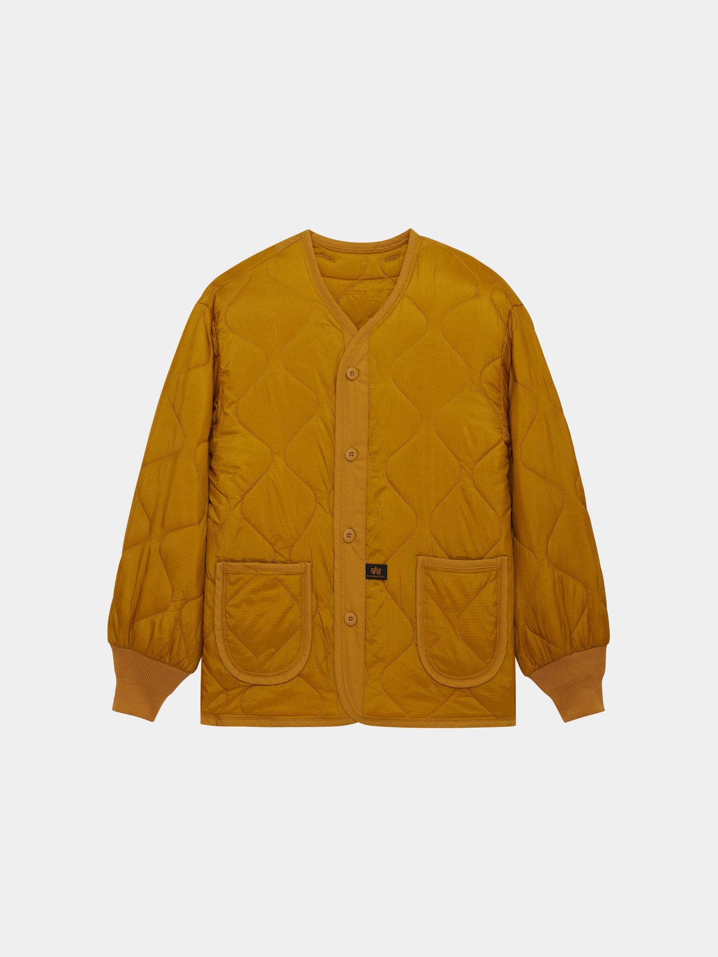 Alpha Industries Als/92 Liner in Tumbleweed, quilted jacket with button front, two patch pockets, ribbed cuffs, V-neck collar.