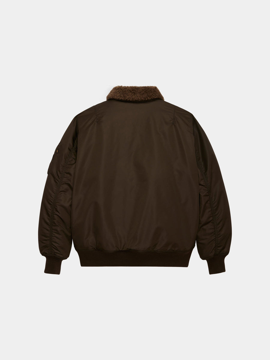 Alpha Industries B-15 Mod Bomber Jacket in dark brown with ribbed cuffs, waistband, and brown faux mouton collar.