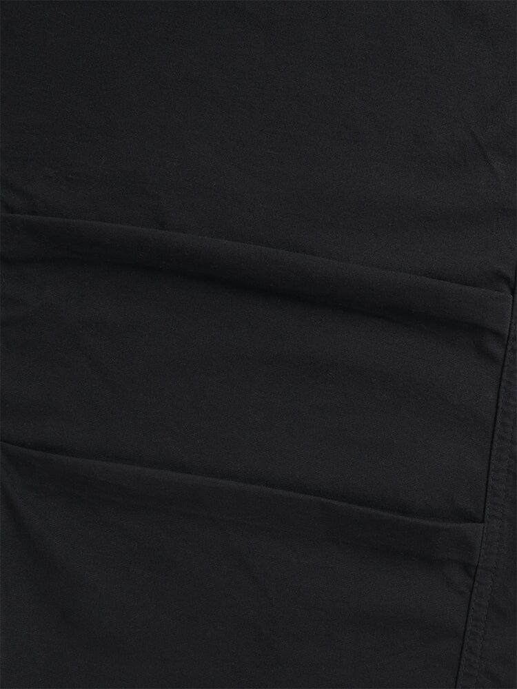 A close-up of the Women's Barrel Leg Pants in black by Alpha Industries highlights the fabric's seams and stitching, radiating the detailed craftsmanship reminiscent of high-waisted pants.