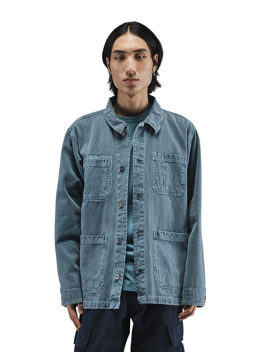 Alpha Industries CTN Chore Coat, blue washed cotton with four front pockets and subtle nylon detailing.