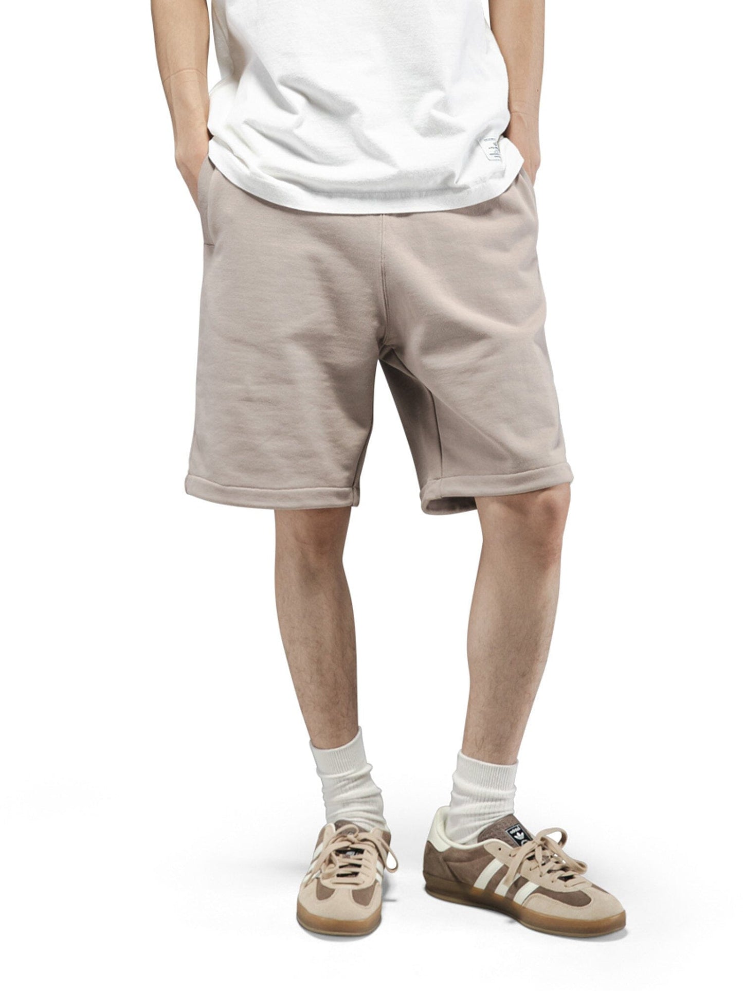 Alpha Industries Essential French Terry Short in beige with elastic waistband and drawstring closure.