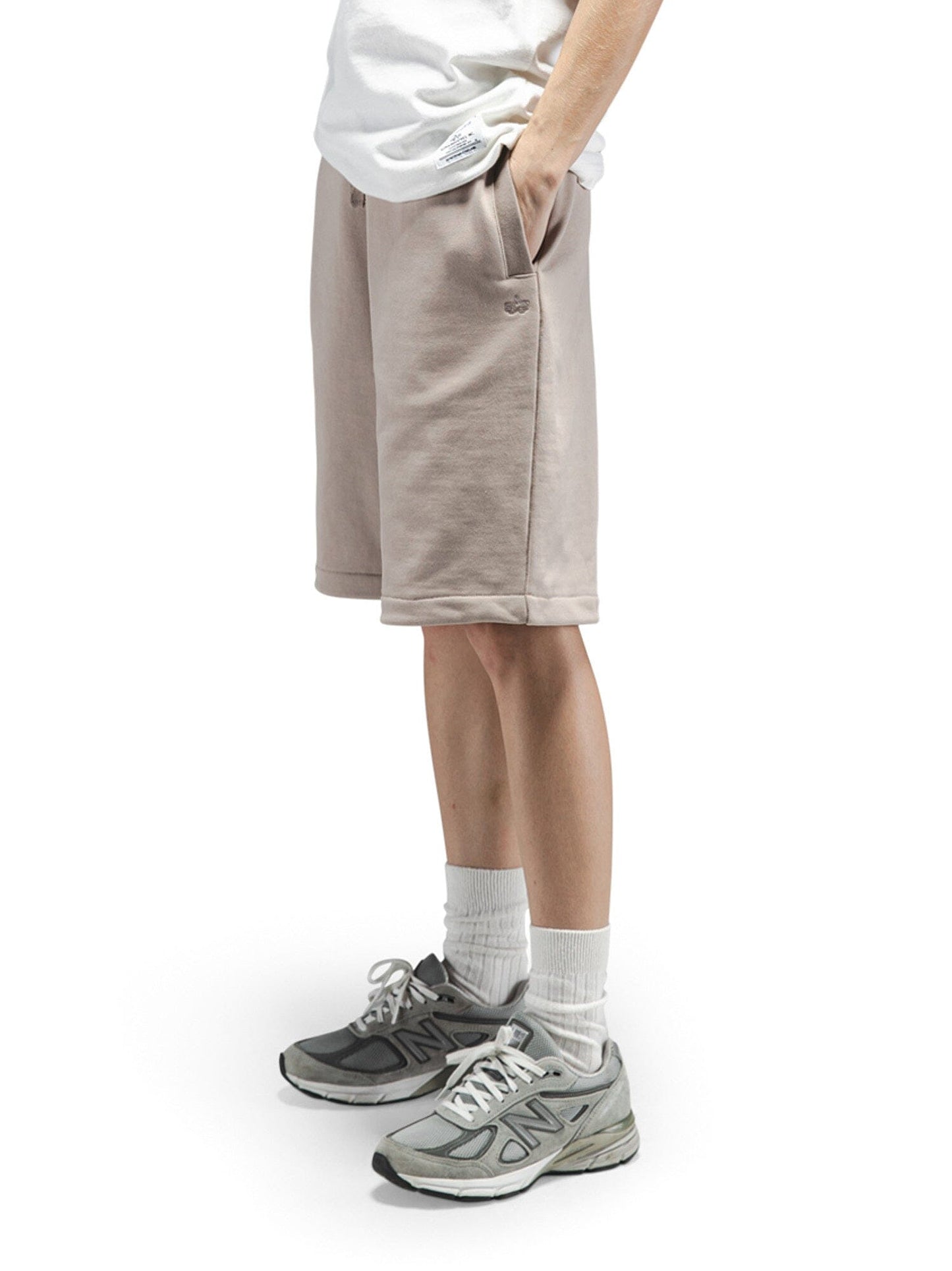 Alpha Industries Essential French Terry Short, beige, knee-length, cotton material, elastic waistband with drawstring.