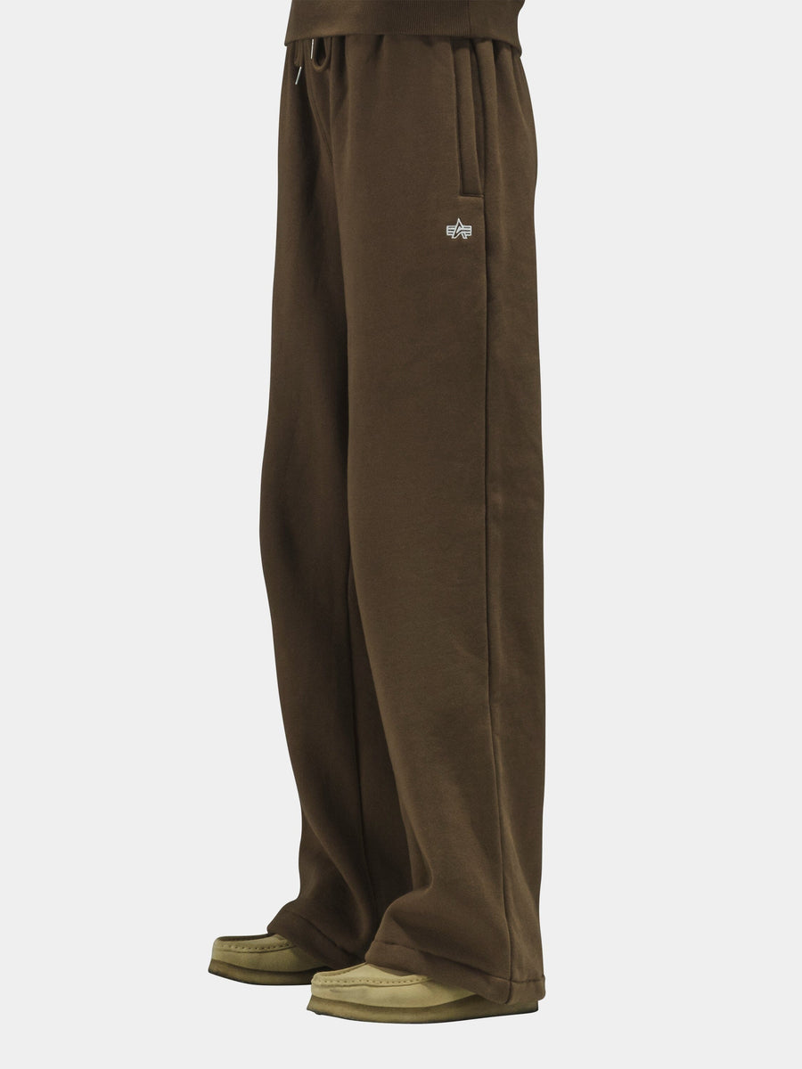 Alpha Industries Essential Sweatpants in cotton, with beige and brown shoes.