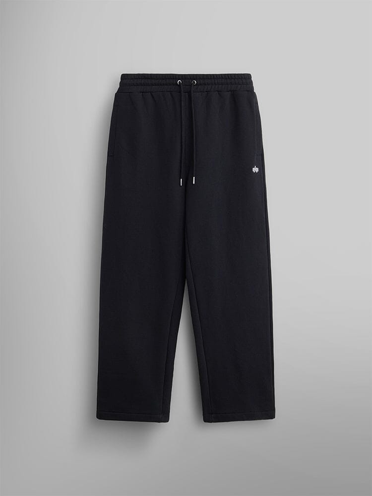 The Women's Essential Sweatpants by Alpha Industries are black and crafted from soft cotton. They come with an elastic waistband and a small embroidered logo on the upper left.