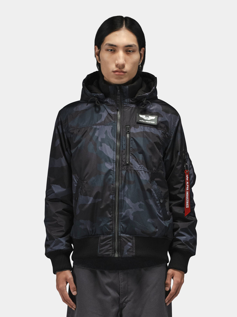 Alpha Industries Hooded Rib Flight Jacket with utility sleeve pocket and Remove Before Flight tag.