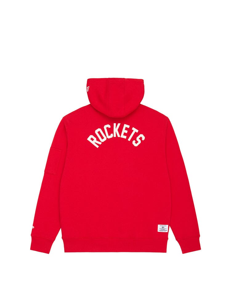 Introducing the Houston Rockets X Alpha X New Era Hoodie by Alpha Industries—a heavyweight fleece in a striking red hue, featuring bold white ROCKETS text on the back and a drawstring hood. This stylish piece also includes a convenient quarter zip and an additional tag at the bottom for added flair.