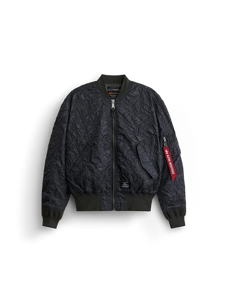 Alpha Industries L-2b Bubble Flight Jacket W in Charcoal, Quilted Textured Shell, Ribbed Cuffs and Hem, Front Zipper Closure, Red Tag on Left Sleeve Zipper Pocket.