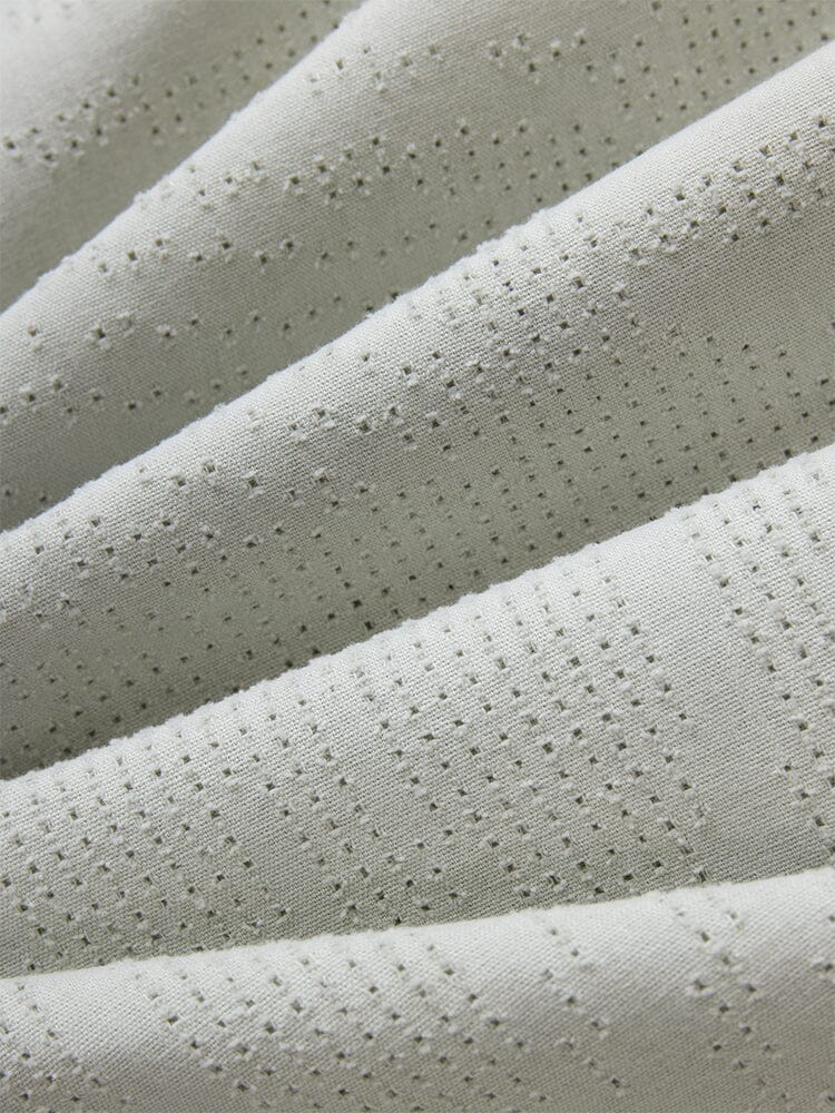 Alpha Industries L-2B Dotted Camo Flight Jacket, pale fabric with small, evenly spaced perforations and camo-inspired pattern.