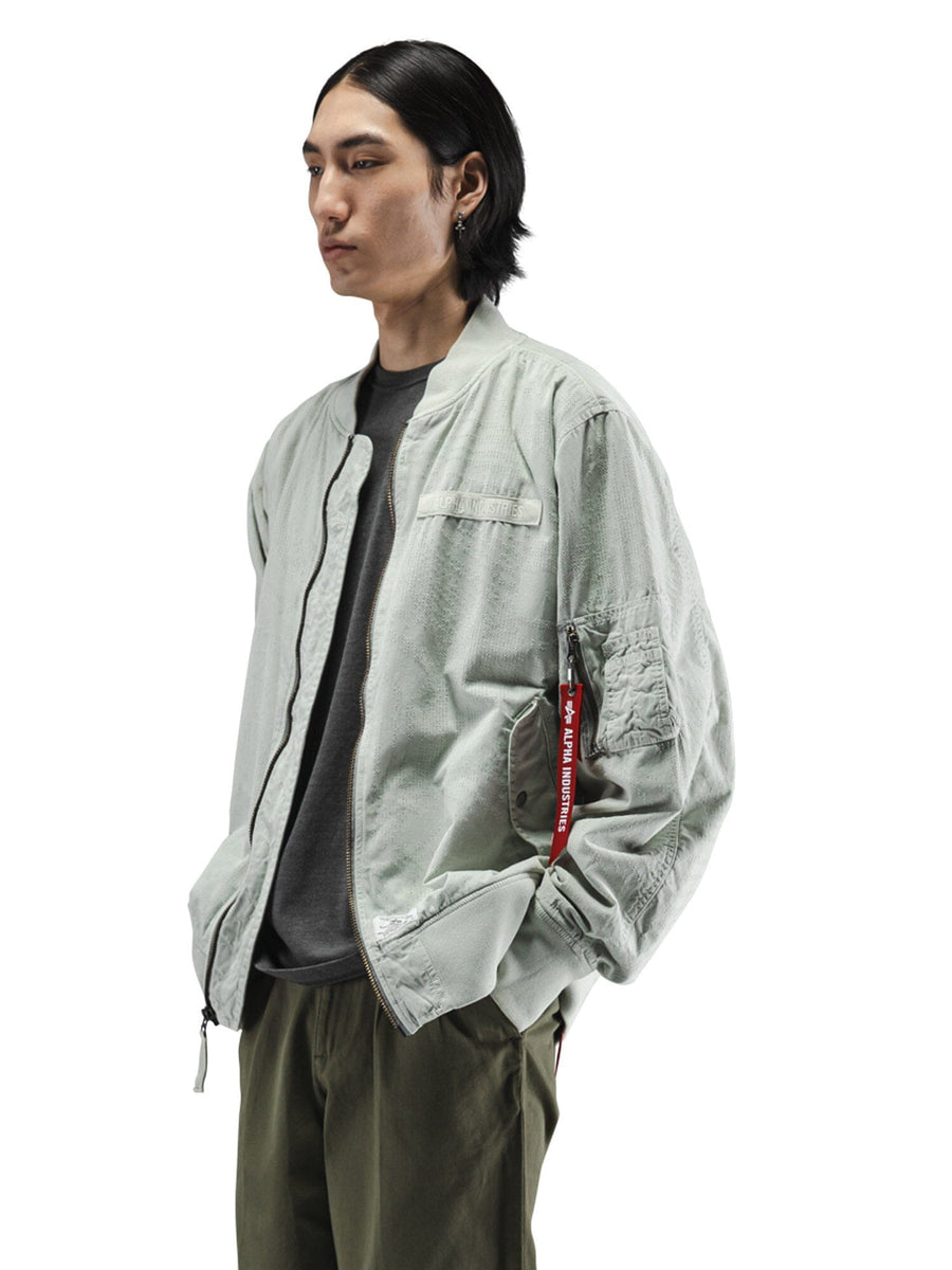 Alpha Industries L-2B Dotted Camo Flight Jacket, utility pockets, camouflage pattern, zip closure.