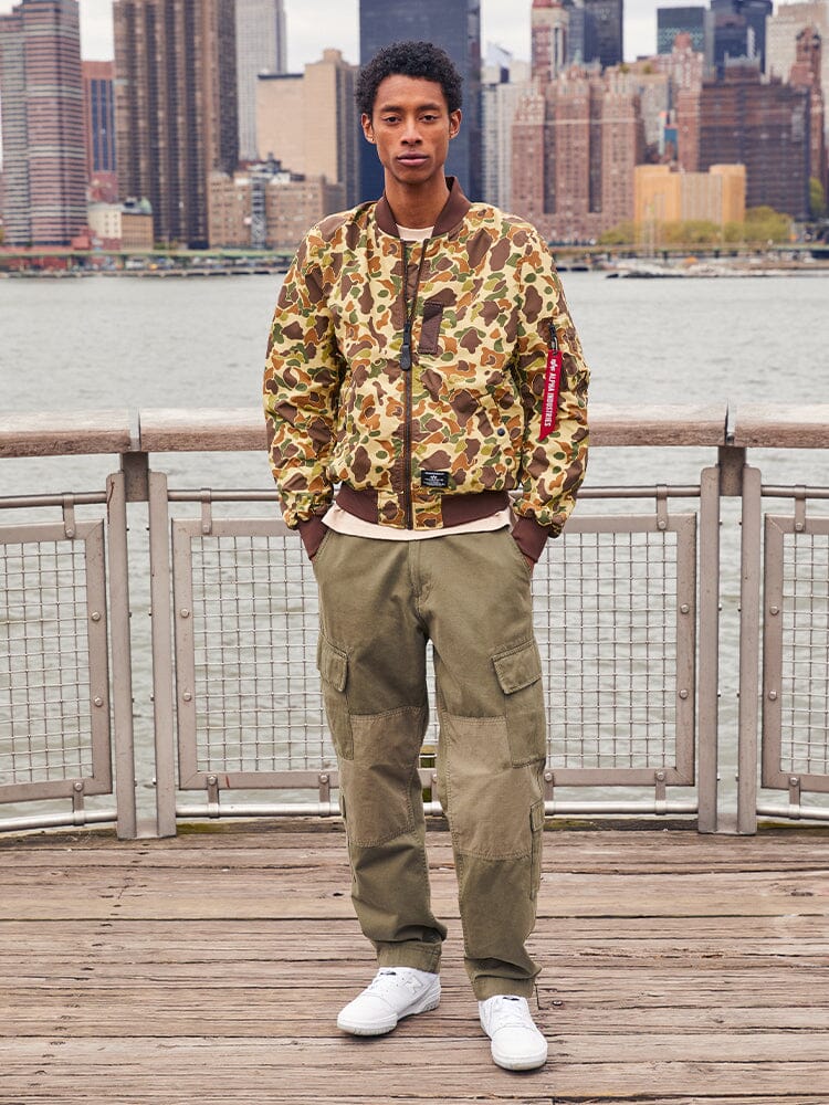 Alpha Industries L-2B Skymaster Gen II Bomber Jacket, olive color, nylon material, front zipper closure, ribbed cuffs and hem.