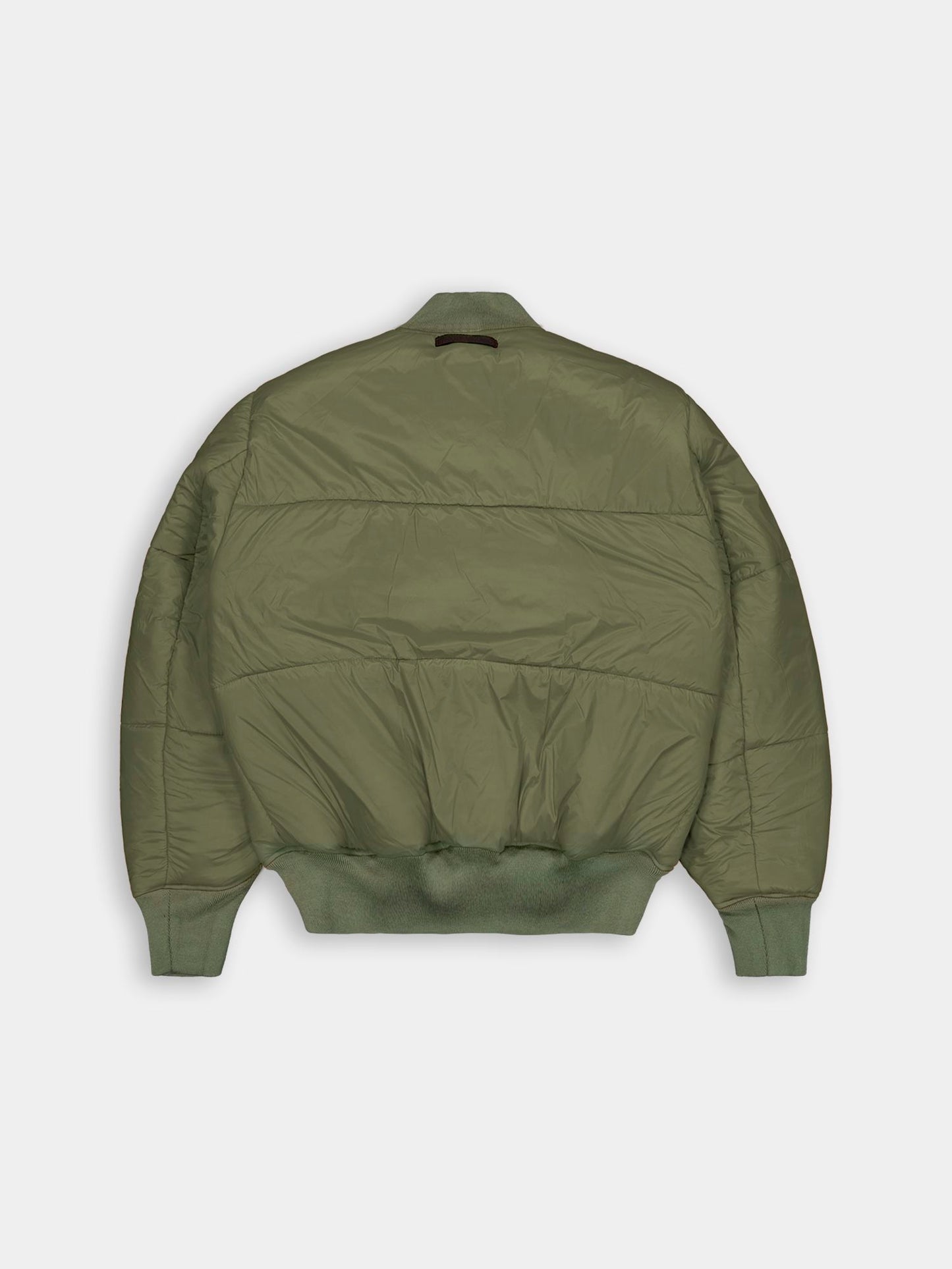 Alpha Industries MA-1 flight jacket in olive green with ribbed cuffs, waistband, collar, and a puffy quilted design.
