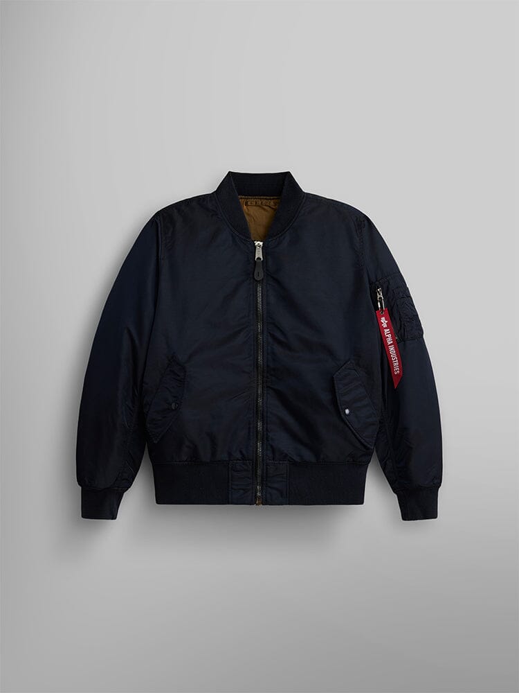 The MA-1 Battlewash Bomber Jacket From Alpha Industries, Inc. Showcases a Zip-Up Front, Ribbed Cuffs, and a Distinctive Red Tag on the Sleeve, Further Enhanced With a Battlewash Finish for That Rugged Look.