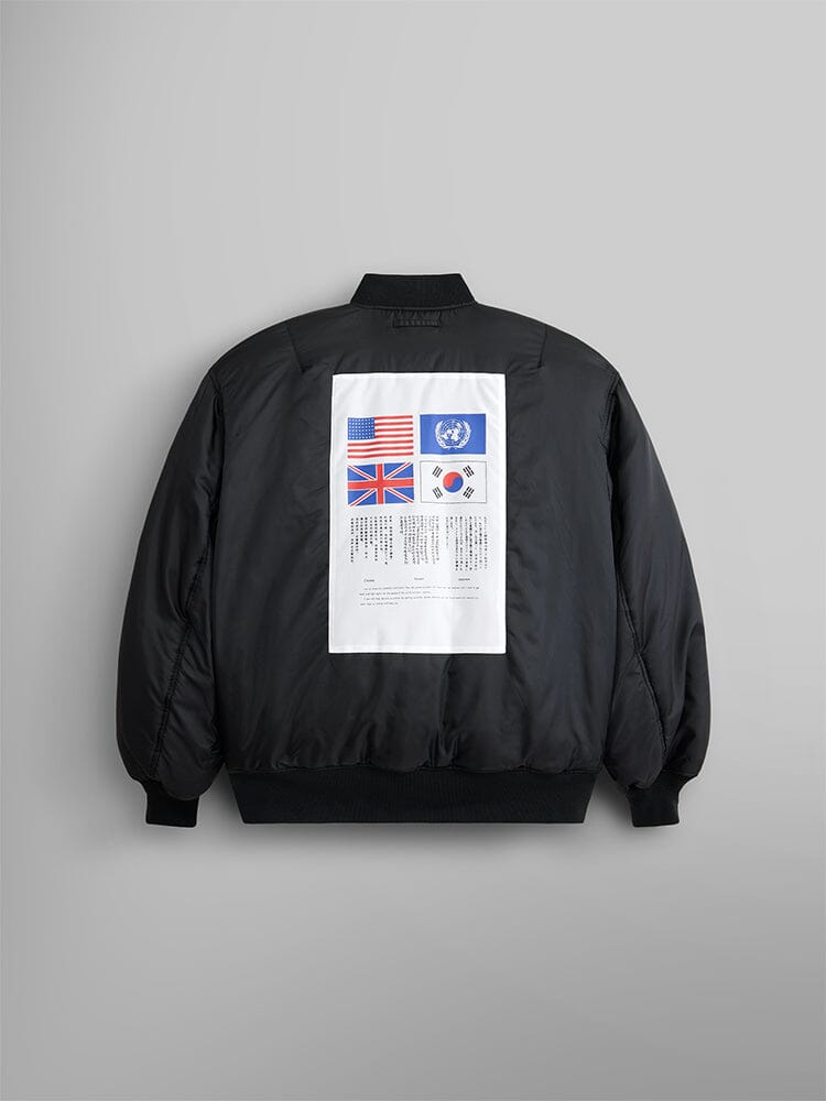 Alpha Industries MA-1 Bloodchit Gen II Bomber Jacket, black, white back patch with USA, UK, UN, and South Korea flags above columns of small black text.