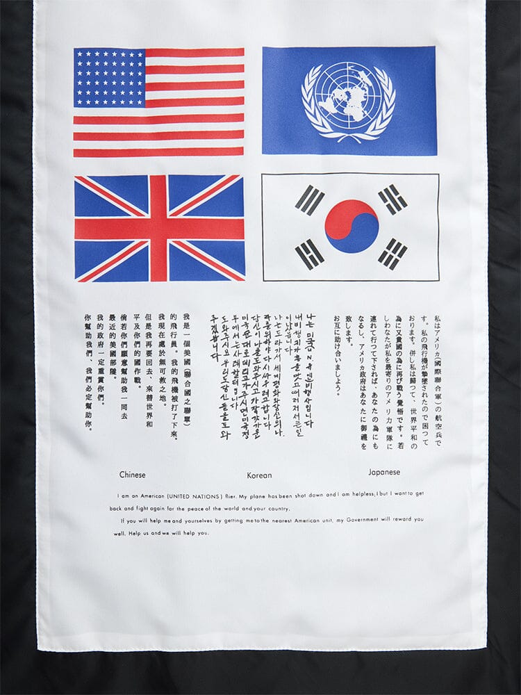 Alpha Industries MA-1 Bloodchit Gen II Bomber Jacket, featuring US, UN, UK, and South Korea flags with messages in Chinese, Korean, Japanese, and English.