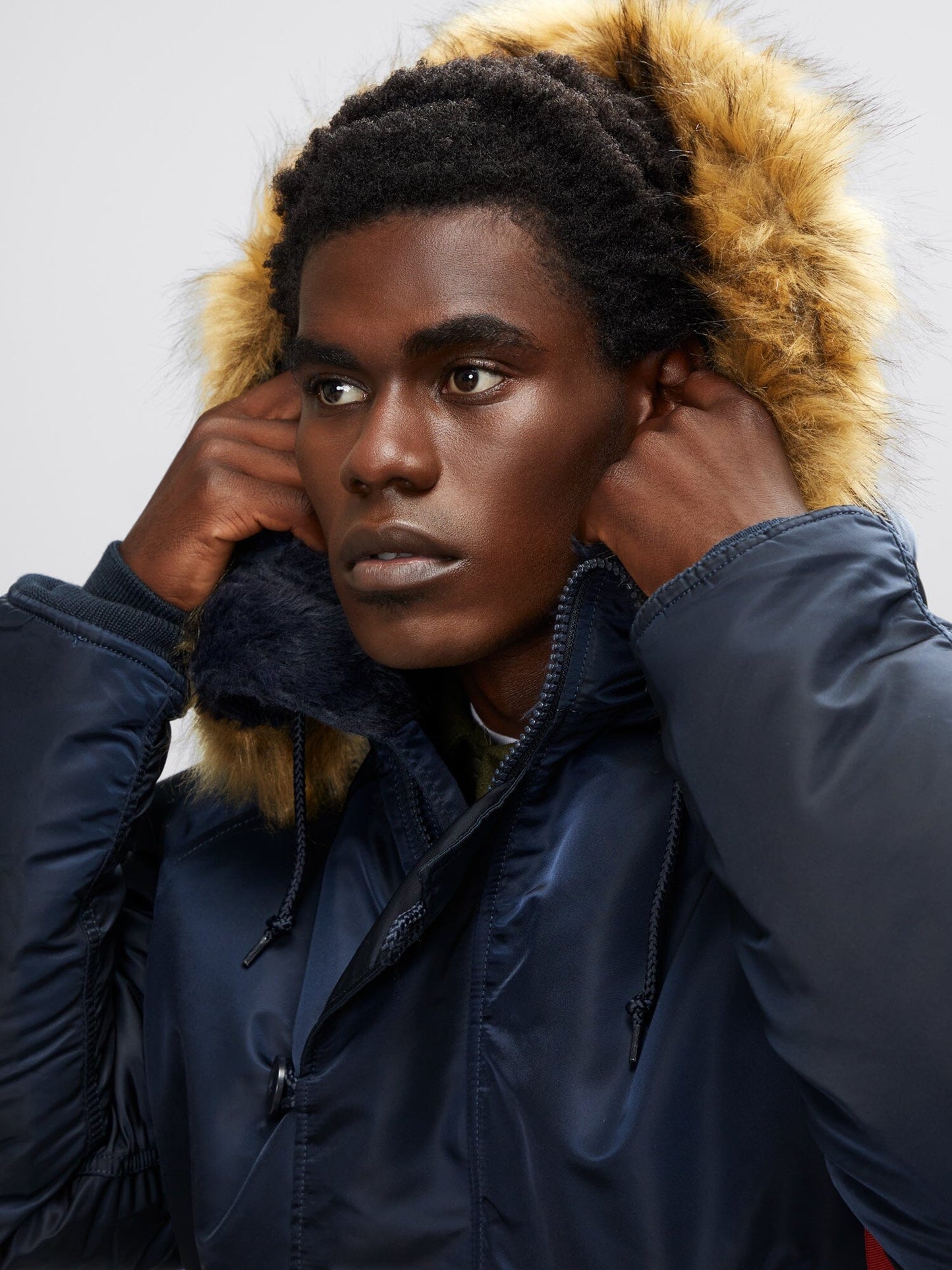 Alpha Industries N-2B Short Waist Parka in navy blue, faux mouton fur-lined hood.