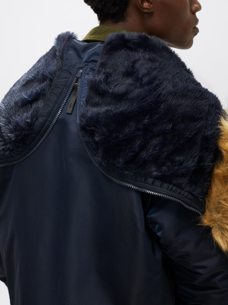 Alpha Industries N-2B Short Waist Parka in navy blue with large faux mouton fur collar and shoulder details.