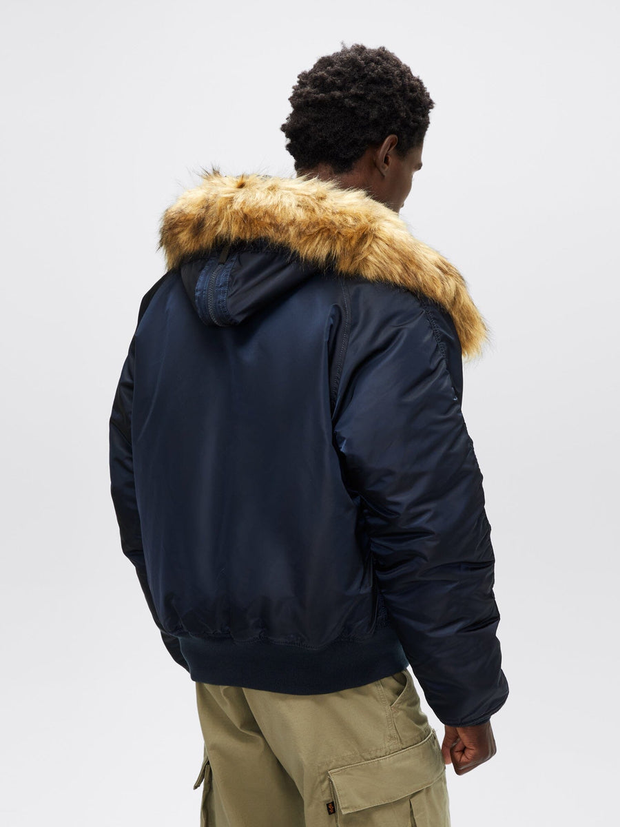 Alpha Industries N-2B Short Waist Parka in navy blue with faux mouton fur-lined hood.