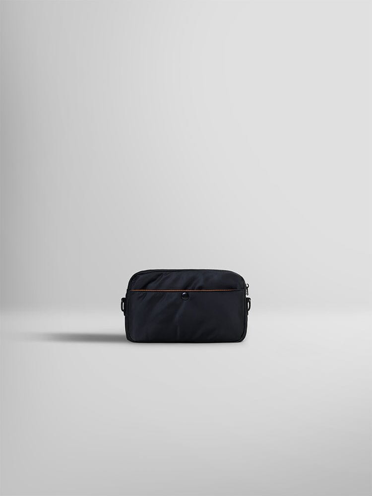 The Nylon Messenger Bag by Alpha Industries is elegantly displayed. This black fabric pouch is crafted from durable nylon and features a brown zipper with side loops.