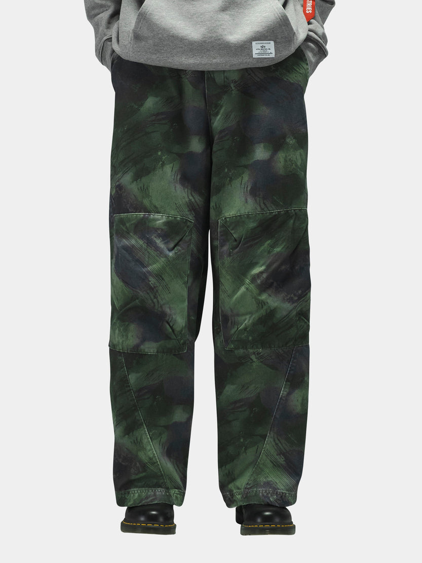 Alpha Industries Oversized Washed Pant, loose-fit green and black camouflage cargo pants made from 100% cotton.