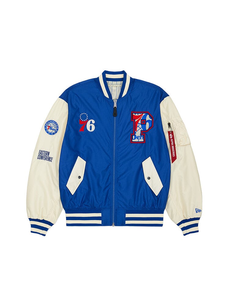 The Philadelphia 76ers x Alpha x New Era L-2B Bomber Jacket by Alpha Industries / NE-NBA features a navy design with large P logo, number 76, and team patches on the front and sleeves, evoking a sense of nostalgia.
