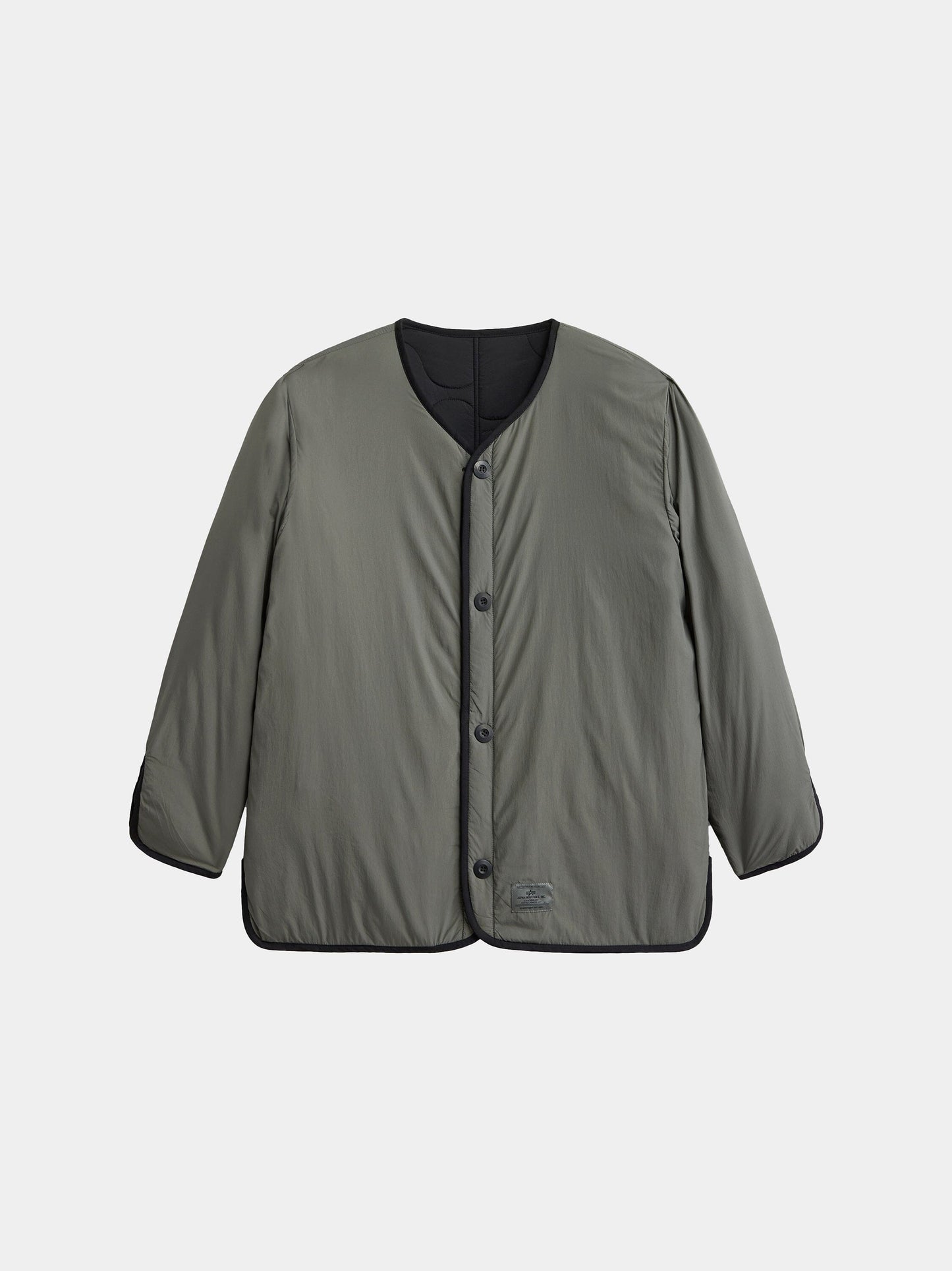 The Alpha Industries Reversible Als/92 Mod Liner Womens is a khaki green nylon ripstop jacket with black trim and a round neckline.