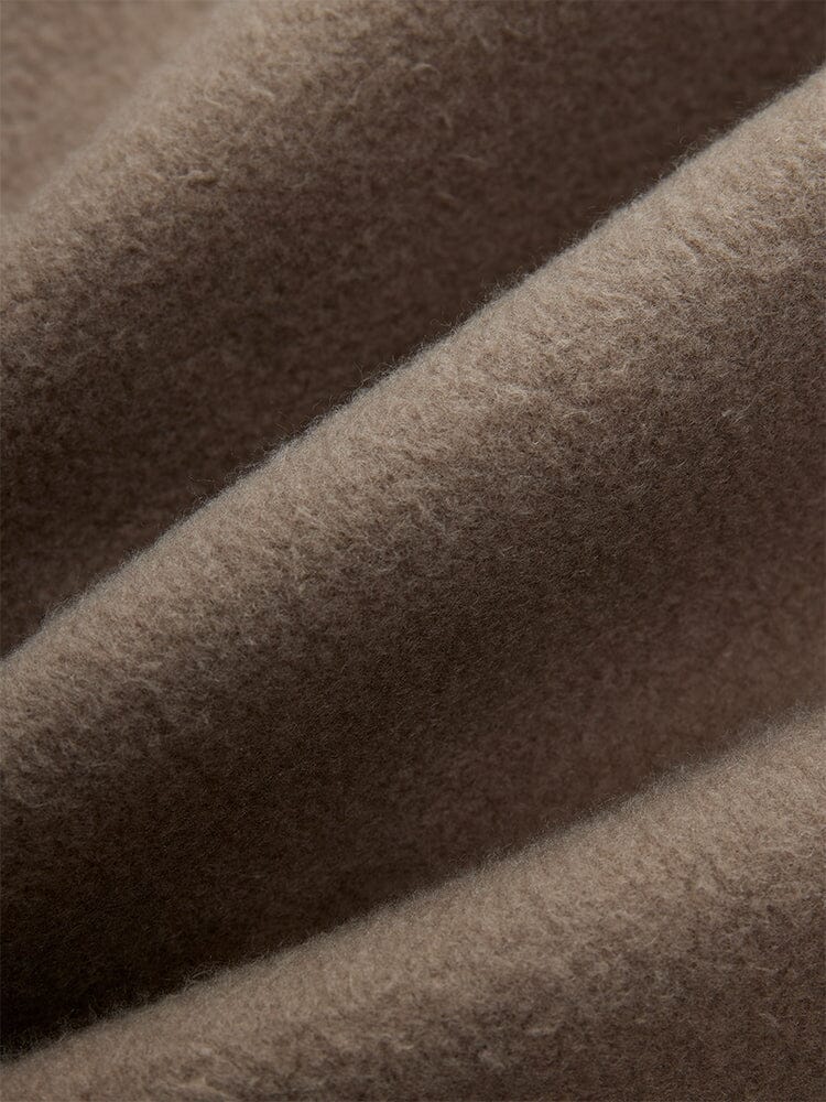 Alpha Industries Essential Sweatpants, Coyote Brown fabric with visible fibers and elastic waistband.