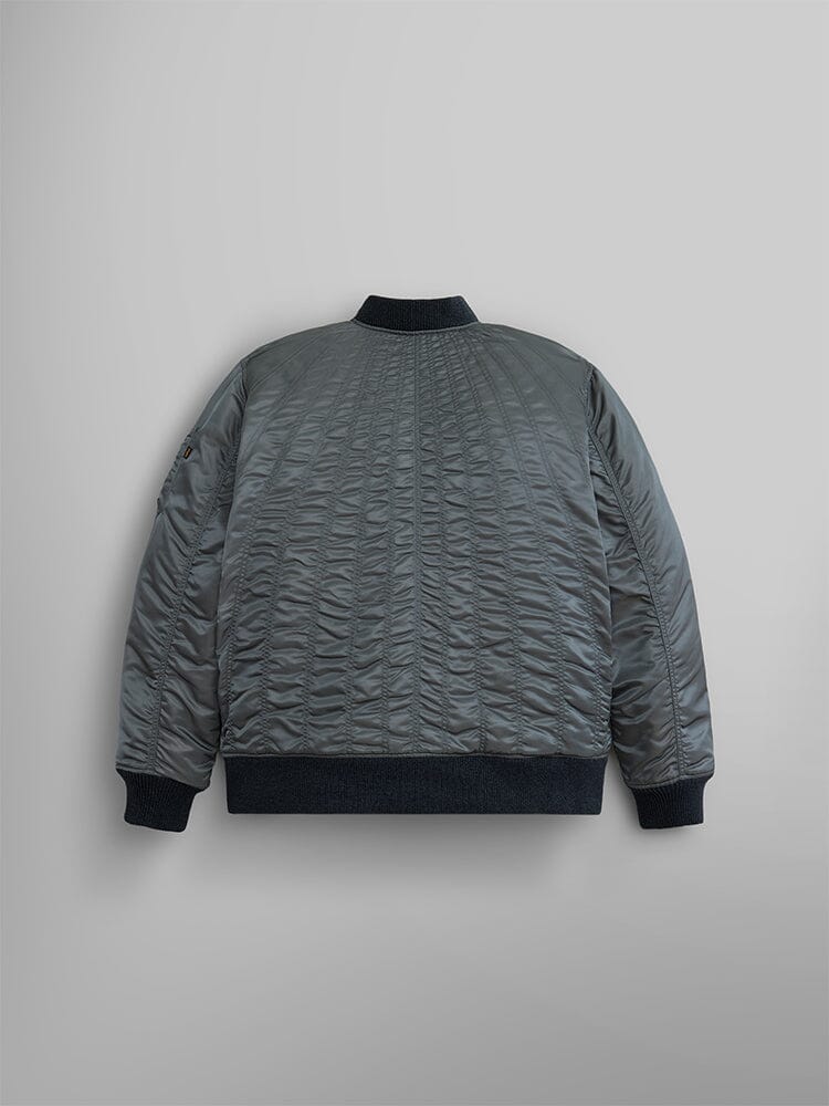 Back view of the Women's MA-1 Shirring Bomber Jacket by Alpha Industries, featuring a quilted pattern in gray, emphasizes its sleek back and vintage nylon finish.