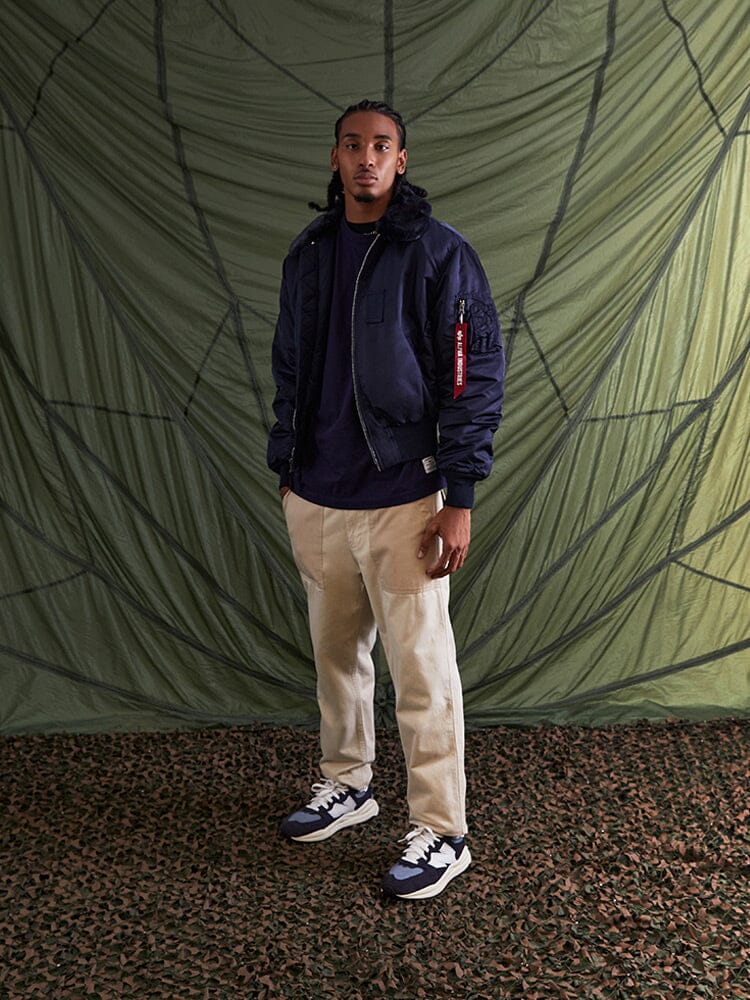 Alpha Industries B-15 Bomber Jacket with removable faux-mouton collar, green color, zip closure.