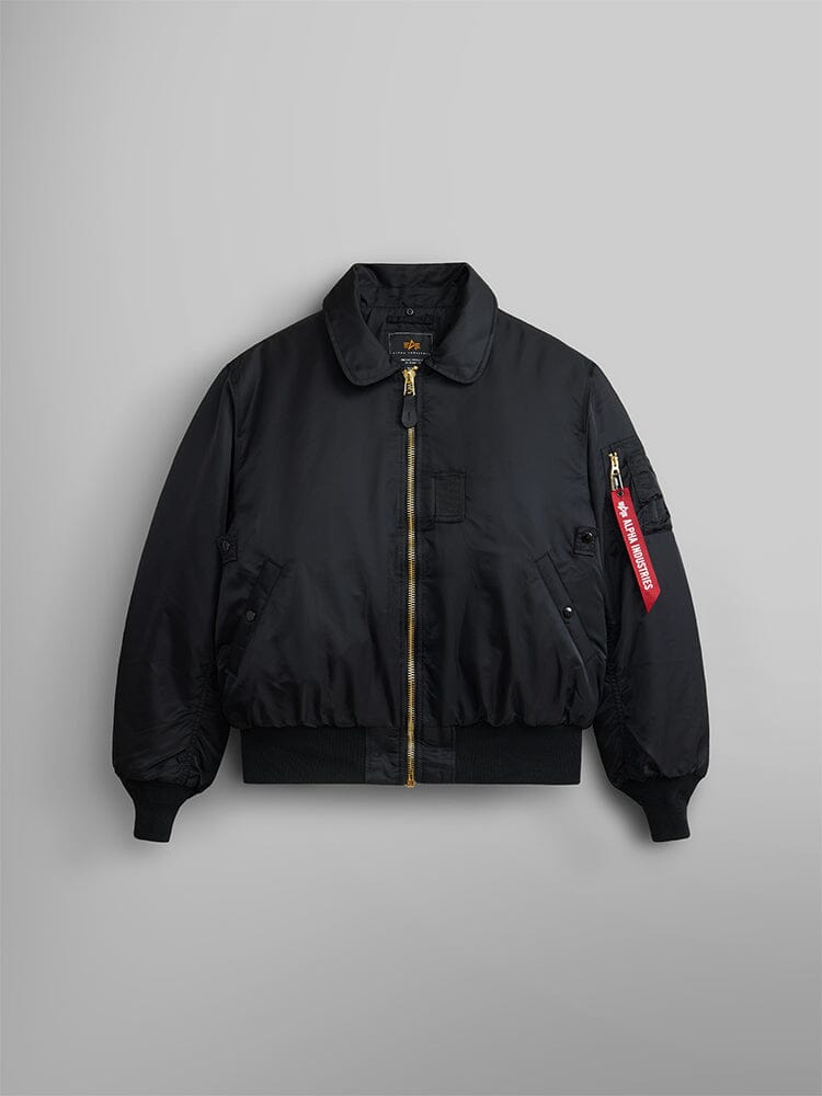 Alpha Industries B-15 Bomber Jacket, black, removable faux-mouton collar, MA-1 gold zipper, ribbed cuffs and hem, front pockets, red sleeve tag.