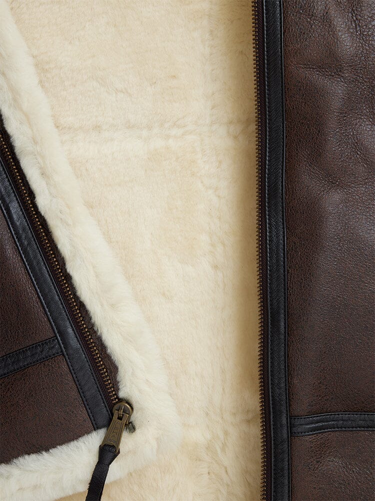 Alpha Industries B-3 Sherpa Leather Bomber Jacket with cream sheepskin lining and metal zipper.