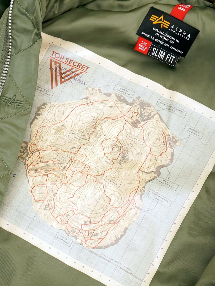 Introducing the Call of Duty X Alpha B-15 Slim Fit Jacket by Alpha Industries, Inc., featuring a green exterior with an interior map lining labeled "Top Secret" in red, reminiscent of Call of Duty missions. The black label proudly reads Alpha Industries and Slim Fit, embodying the classic style of a B-15 Flight Jacket—a must-have for any Vanguard Task Force enthusiast.