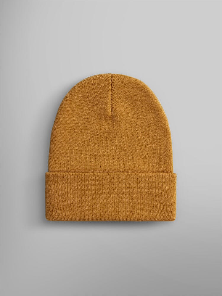 Essential Beanie by Alpha Industries in mustard yellow with folded brim and Alpha paper label.