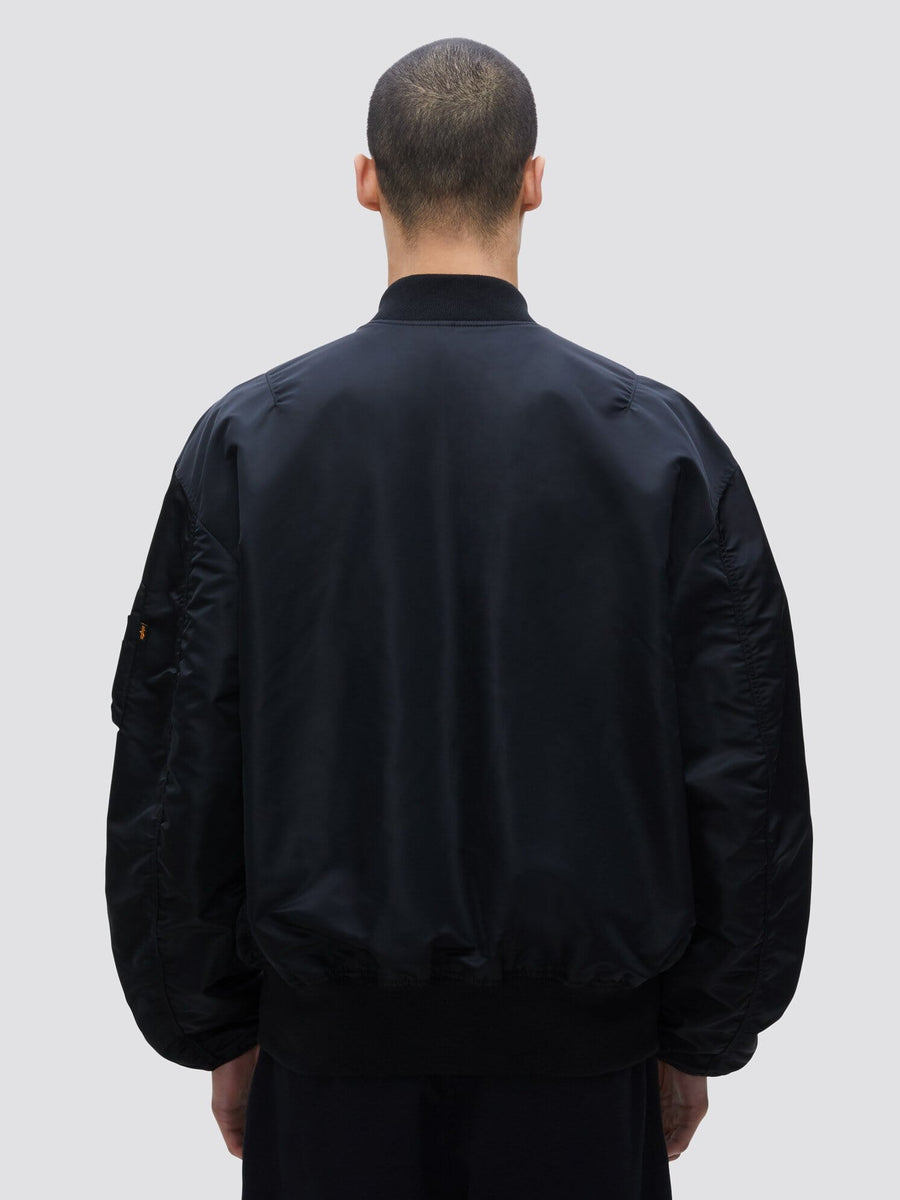 Alpha Industries L-2B Loose Bomber Jacket, black, features loose fit and zip closure.