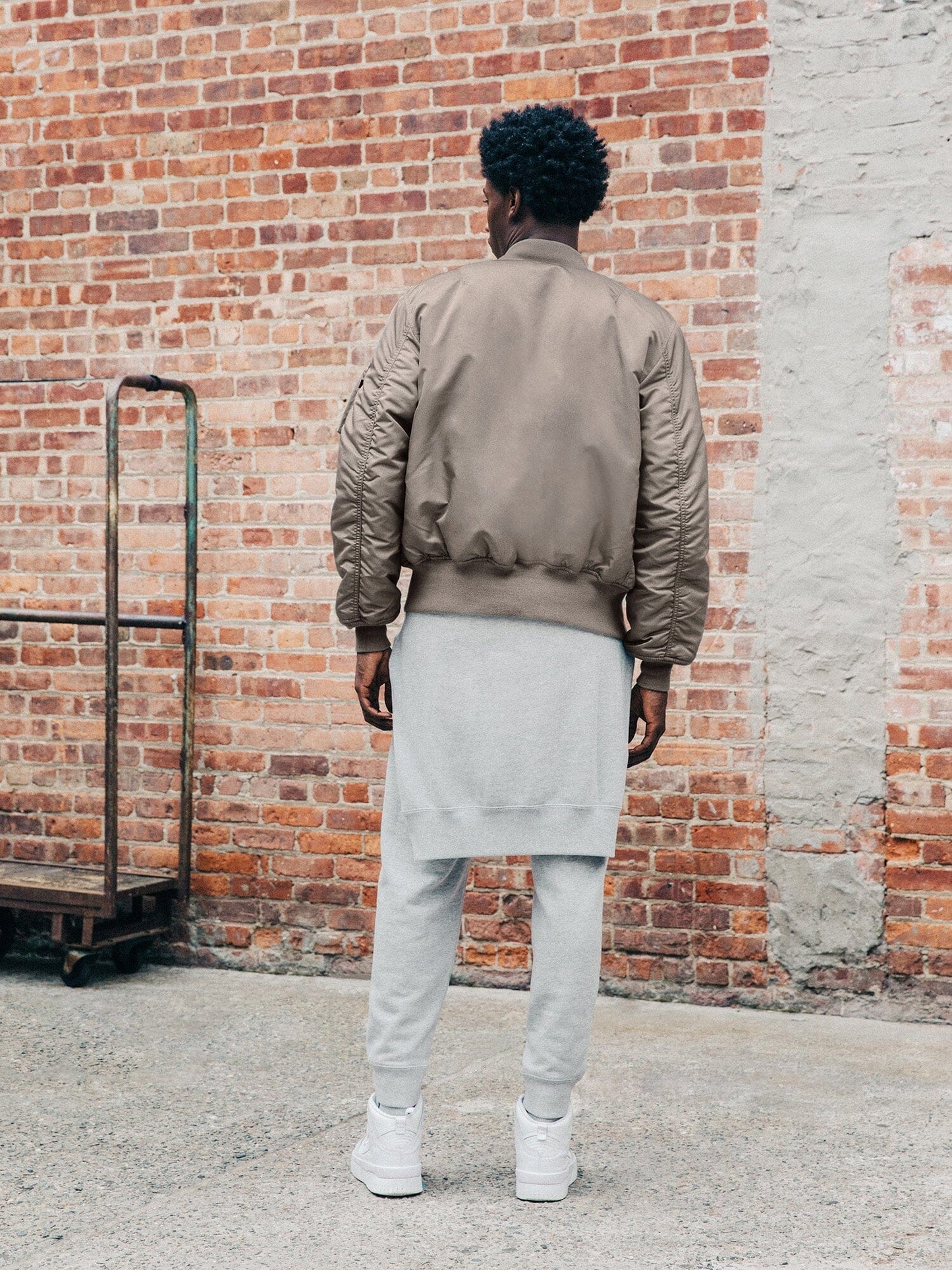 Back view of MA-1 Bomber Jacket (Heritage) in Gray with male model. Full body view. By Alpha Industries.