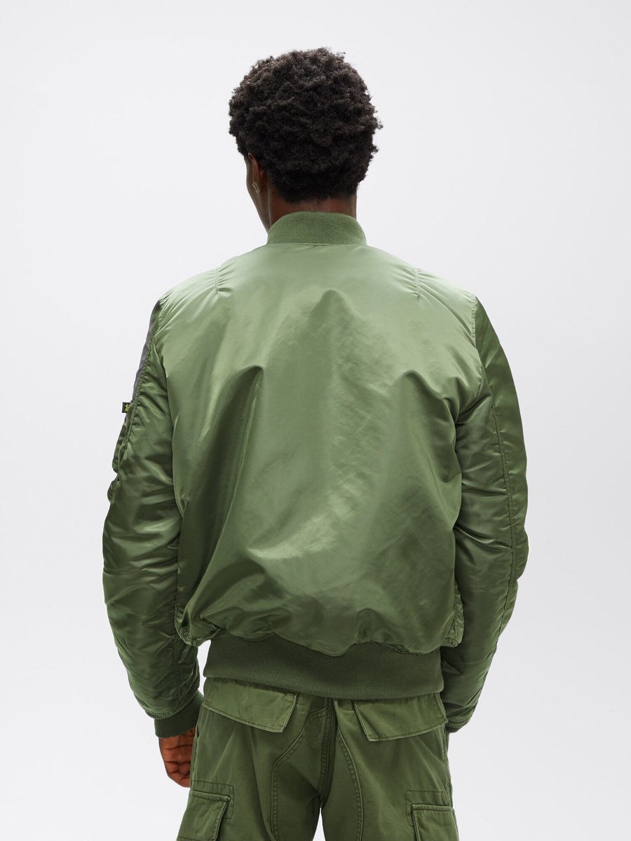 Full-body back view of sage green Alpha Industries MA-1 Bomber Jacket Slim Fit showing ribbed hem and cuffs.
