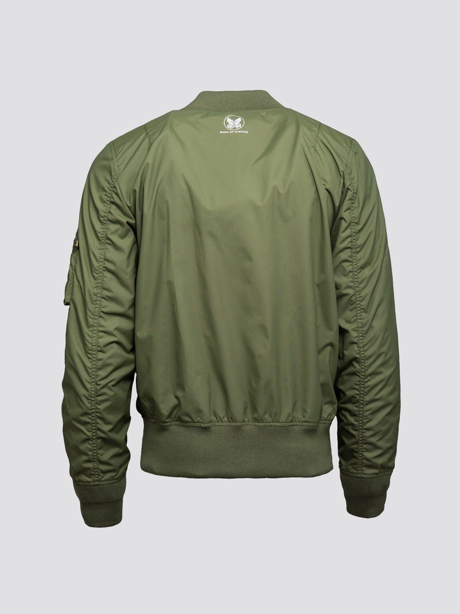 Alpha Industries MA-1 Skymaster Bomber Jacket, olive green, ribbed cuffs, waistband, collar, small white logo on upper back.