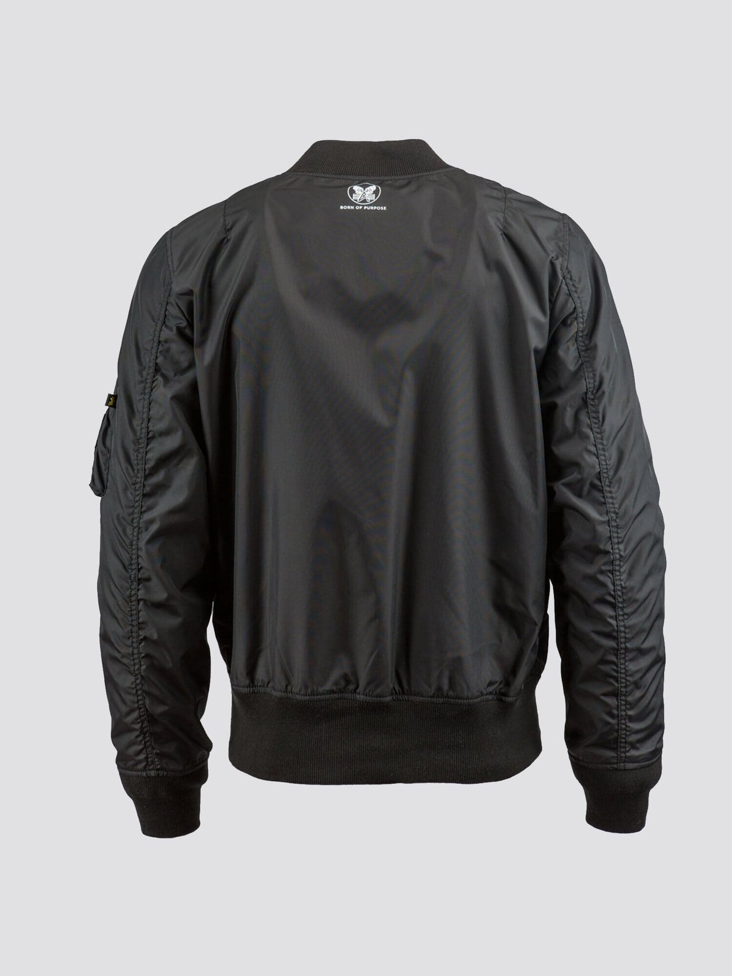 Alpha Industries MA-1 Skymaster Bomber Jacket in black with ribbed cuffs, hem, collar, and small upper back patch.
