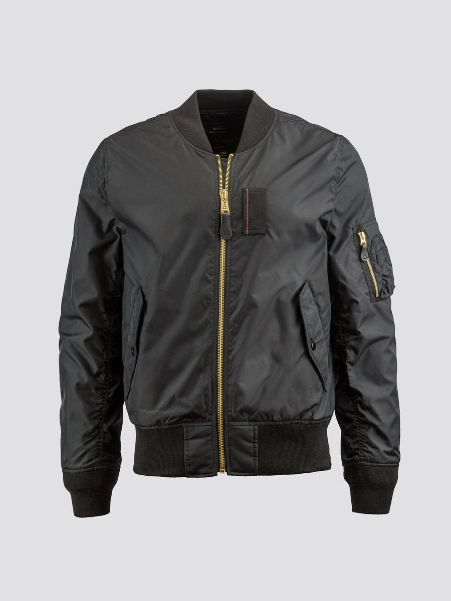 Alpha Industries MA-1 Skymaster Bomber Jacket in Black, gold zipper, ribbed collar, cuffs and hem, front flap pockets, zippered left sleeve pocket.