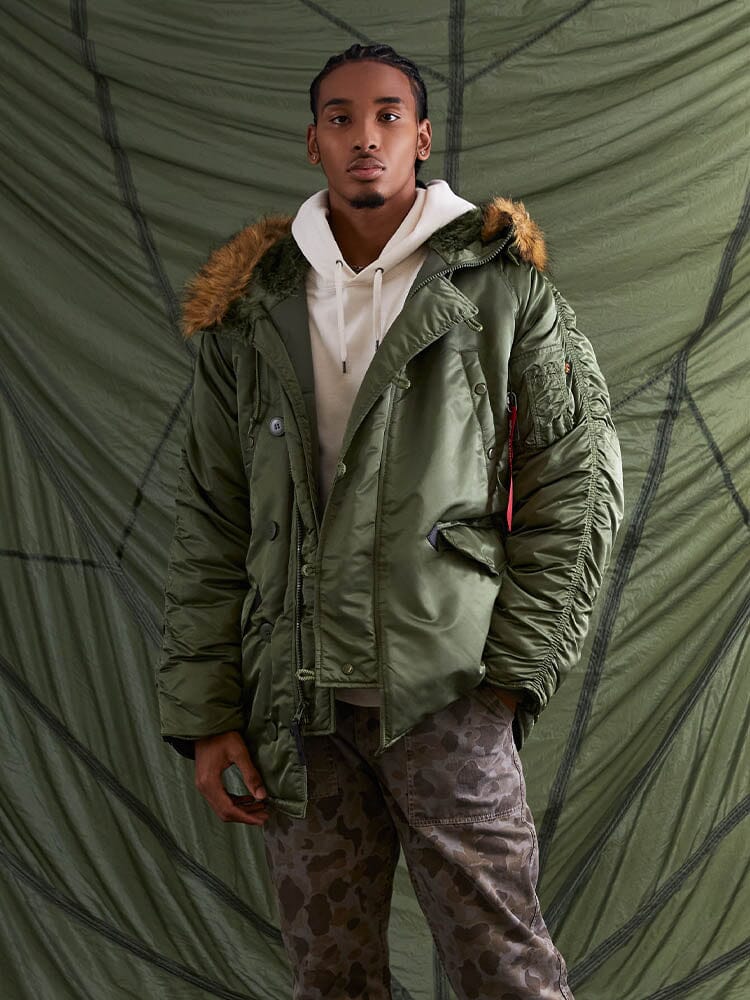 Alpha Industries N-3B Parka with fur-lined snorkel hood, green fabric, MA-1 utility pocket, zip front closure.