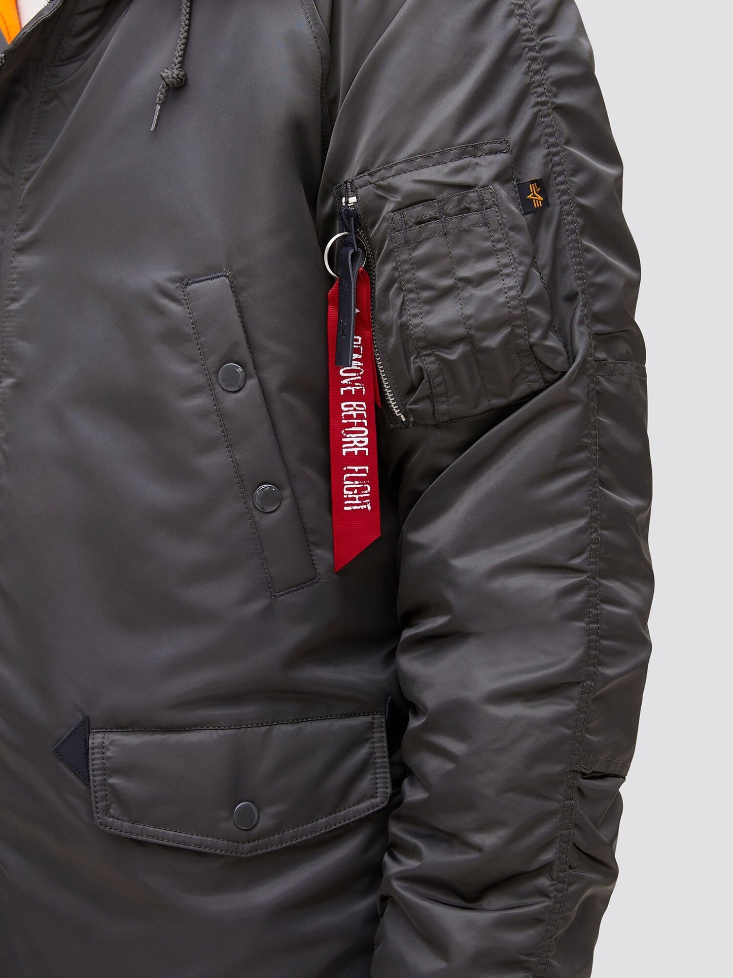 Alpha Industries N-3B Slim Gen I Parka, dark green, water resistant, snap pockets, zippered sleeve pocket, red Remove Before Flight tag.