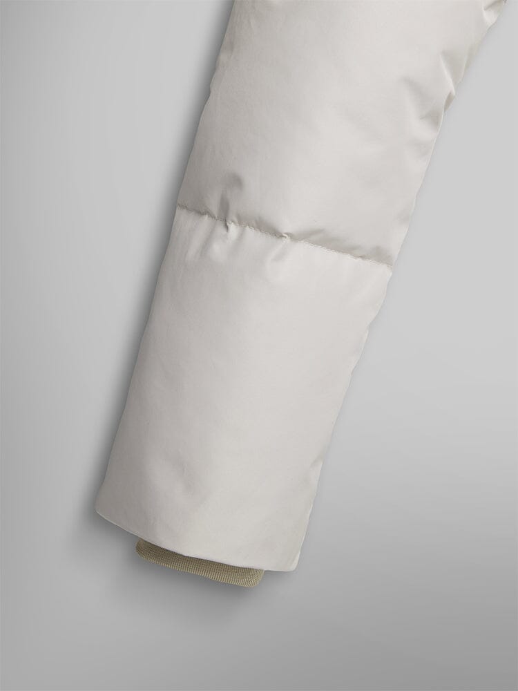 Alpha Industries Short Parka W, light gray with quilted stitching and beige ribbed inner cuff.