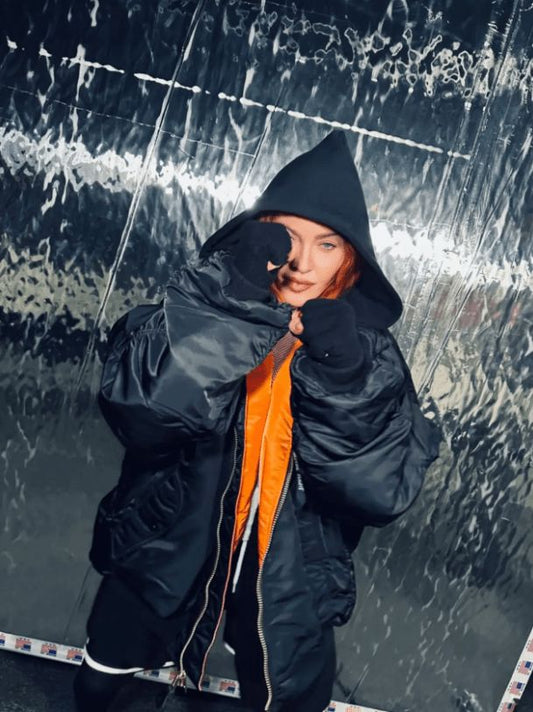 Photo of Madonna in an Alpha Industries Blond Ambition Tour bomber jacket.