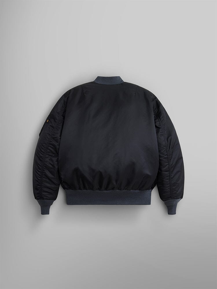 Back view of the 1960s MA-1 Bomber Jacket in black by Alpha Industries, featuring ribbed collar, cuffs, and hem.